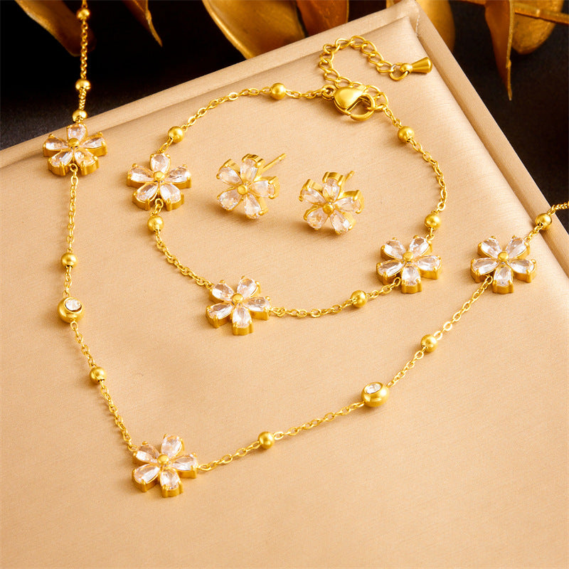 Set de collar, pulsera y aretes de acero inoxidable con circonita floral