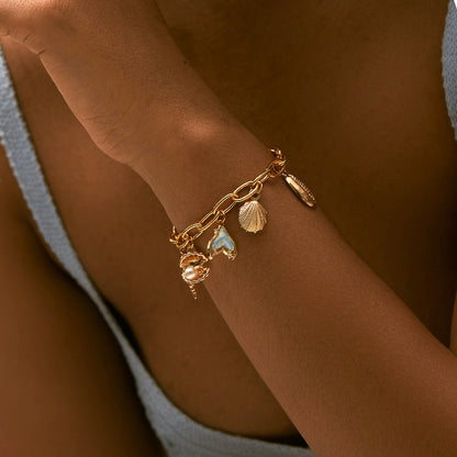 Pulsera con dije de cobre con baño de oro de 18 quilates