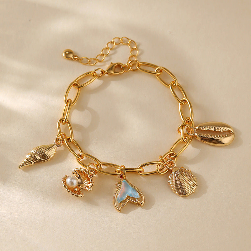 Pulsera con dije de cobre con baño de oro de 18 quilates