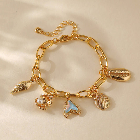 Pulsera con dije de cobre con baño de oro de 18 quilates